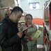  图为郑燕斌先生在卖炭翁仓储中心详细了解卖炭翁竹炭产品